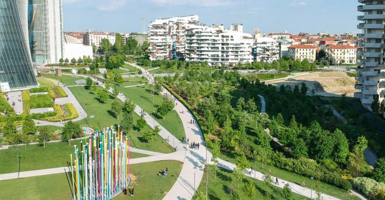 An aerial view of a large park between office buildings.