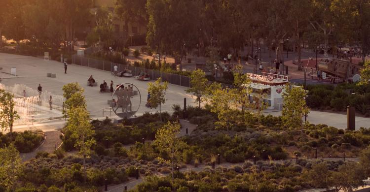 An aerial view of a large park and water feature.